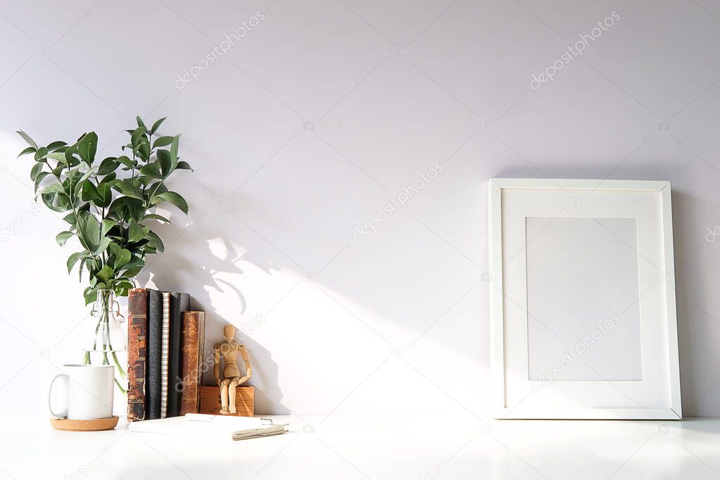 Mockup workspace desk and copy space books,plant and coffee on white desk