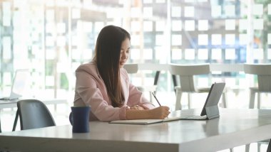 Business people in the office are planning a strategy for the future of the business.	