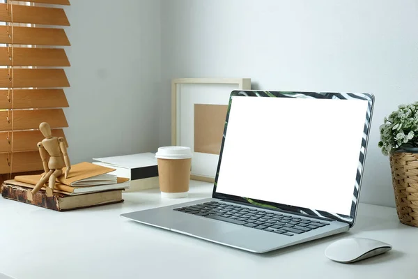 Modern workspace with computer with blank screen and equipment on white table.Blank screen for your information.