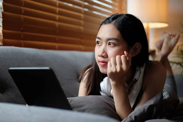 Smiling Young Woman Sitting Comfortable Sofa Using Digital Tablet — стокове фото