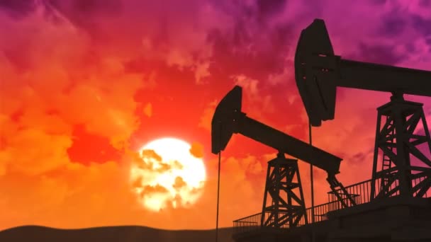 Silhuetas de bombas de óleo de trabalho ao pôr do sol — Vídeo de Stock