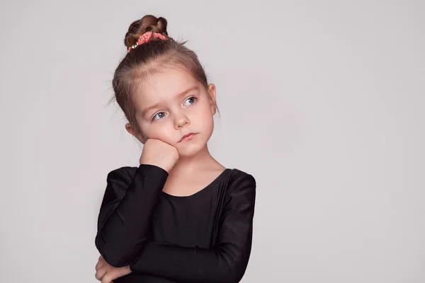 Girl in black thinking serious — Stock Photo, Image