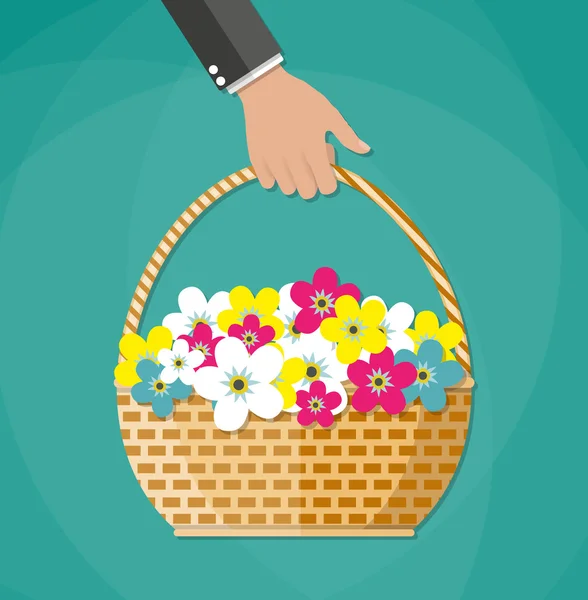 Mão transportando cesta com flores — Vetor de Stock