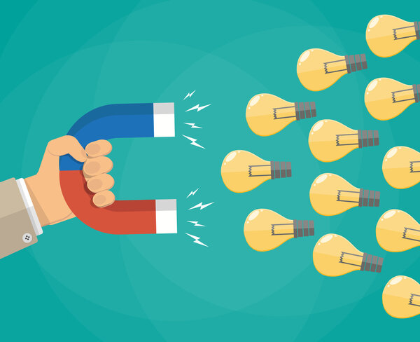 Рука с магнитом, притягивающая идею лампочек
