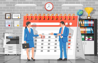 İş adamı ve iş kadınıyla kağıt takvimi.