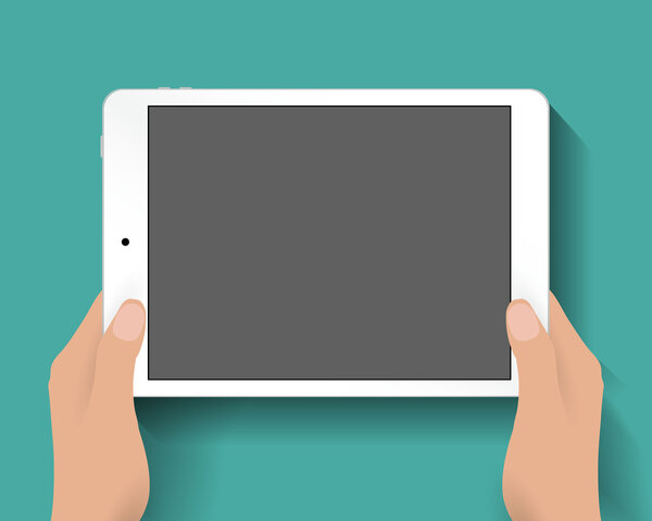 Hands holding tablet computer