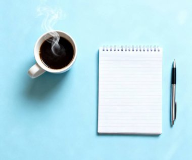 Notebook And Coffee On Blue Desk
