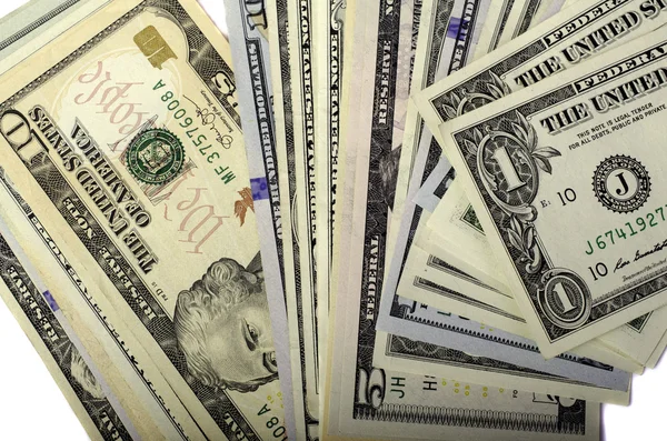 Dollar i olika valörer på vit bakgrund. — Stockfoto