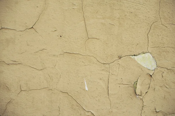 Kırık sıva ile eski parlak duvar.