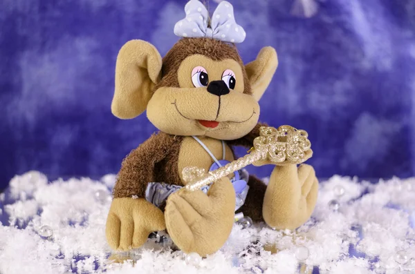Scimmia di Natale con fiocco. Con la chiave nelle gambe . — Foto Stock