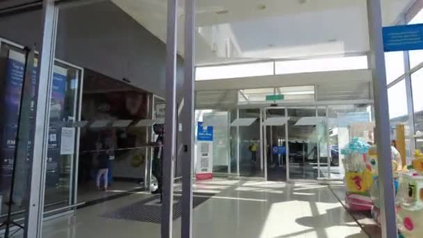 Kuala Lumpur, Malaysia - March 28, 2021 Entering Lotus’s Tesco automatic door for grocery shopping. — Stock Video