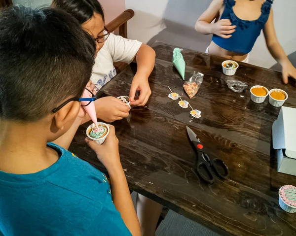 Kids Decorating Cupcakes Home Baking Project Stock Picture