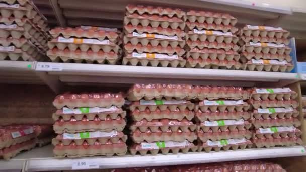 Bangi, Malaysia - March, 2021 Zoom in view of egg cartons on the shelves at Lotus Supermarket. Close up. 4k — Stock Video