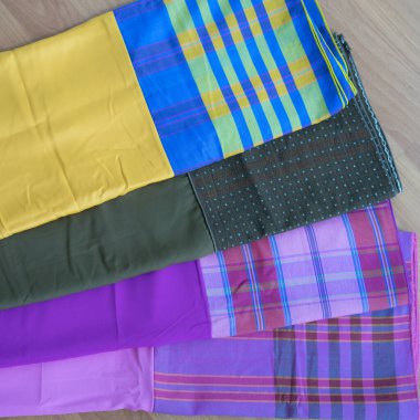 multi-colored pillowcases on background, close up