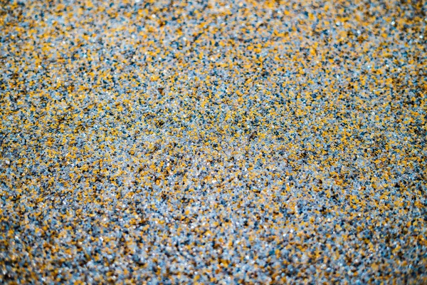 Color flake flooring textured background .Close up.Color Flakes make resinous flooring as beautiful as it is practical.Concrete floor,sprinkle with flake stone and smooth.