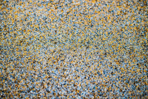 Color flake flooring textured background .Close up.Color Flakes make resinous flooring as beautiful as it is practical.Concrete floor,sprinkle with flake stone and smooth.