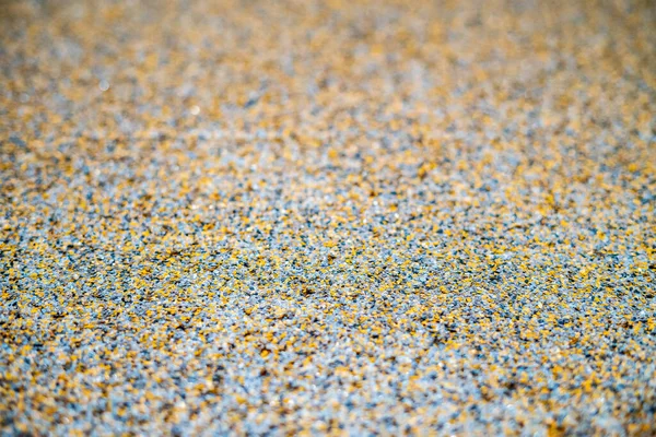 Color flake flooring textured background .Close up.Color Flakes make resinous flooring as beautiful as it is practical.Concrete floor,sprinkle with flake stone and smooth.