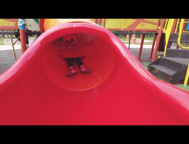 Little Girl Riding Slide Playground Slow Motion — Stockvideo