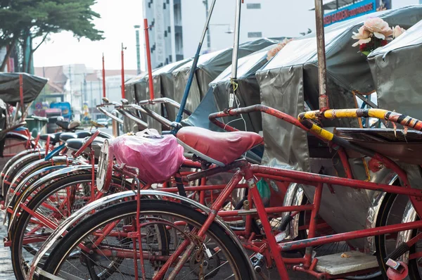 stock image Georgetown Penang - April 25 2019 :  Vintage Trishaw stop beside road for service traveller