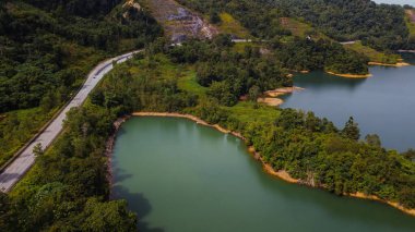 Green lake and rainforest tropical trees in Kuala Kubu Bharu, Malaysia.