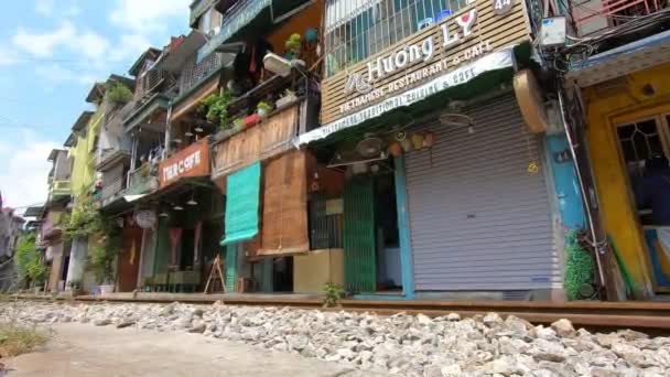 Railway along buildings in Hanoi, Vietnam. Low angle view — Stock Video