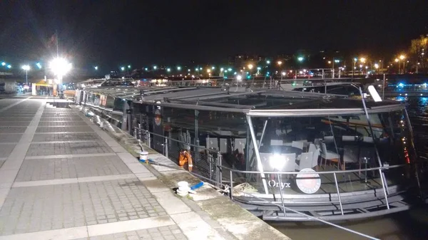 Nice late evening view of boats near Eiffel tower in Paris for the night river ride
