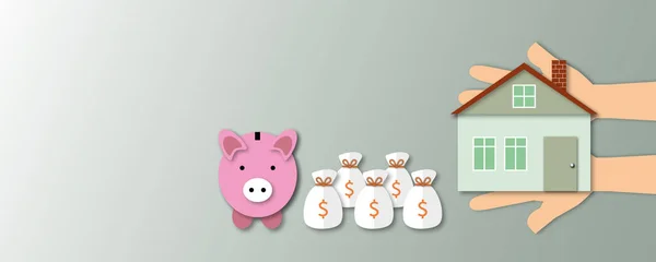 Hand holding a house with piggy banks and money bags on grey background, concept save money to buy a house, paper cut design style.