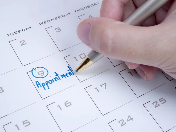 Mujer mano escribir cita en el calendario 1 —  Fotos de Stock