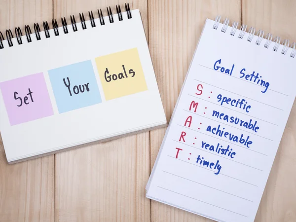Set your goals and SMART Goal on notebook 1 — Stock Photo, Image