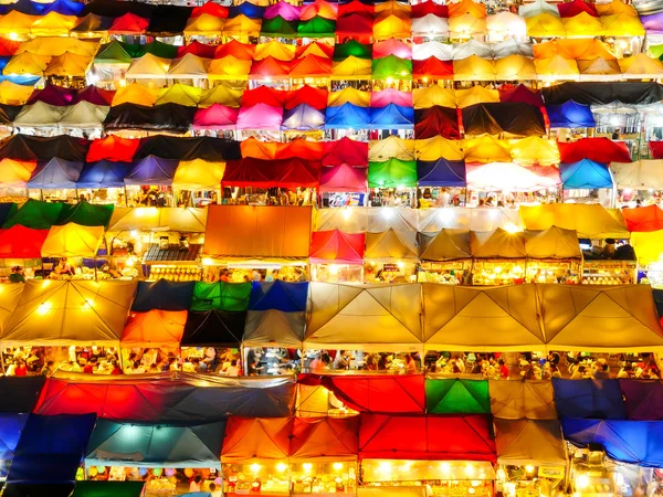 Colorful tent retail shop at night 1