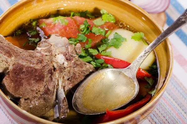 Soup shurpa - traditional oriental dish with lamb — Stock Image Soup shurpa - traditional oriental dish with lamb Stock Photo