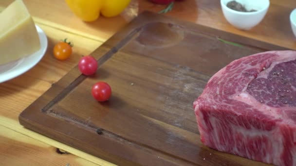 A piece of cake sitting on top of a wooden cutting board — Stock Video