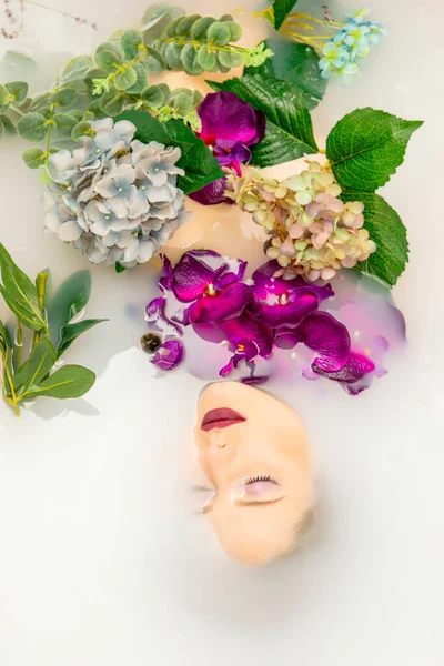 woman takes a bath with flowers