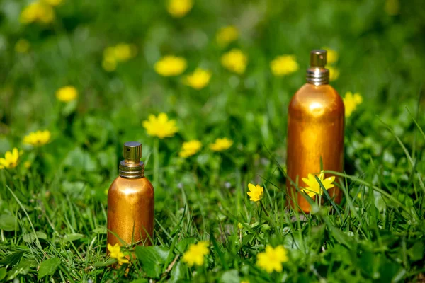 Golden Perfume Bottles Yellow Flowers Meadow Spring Time — Stok fotoğraf