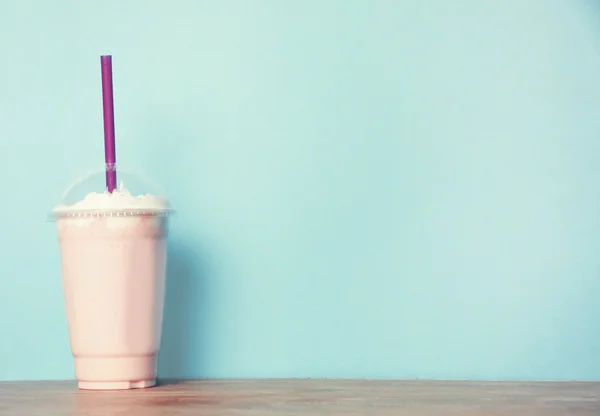 Milkshake on the blue background — Stock Photo, Image