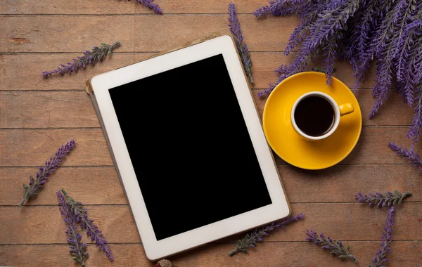 Tablet with cup of coffee — Stock Photo, Image