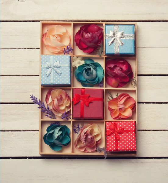 Present boxes with flowers — Stock Photo, Image