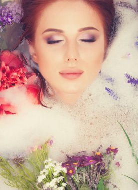 girl in the bathroom with flowers