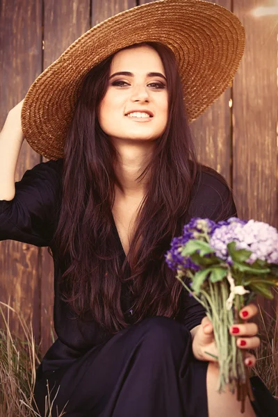 Brunette bride with flowers — Stock Photo, Image