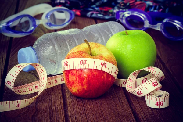 Healthy eating, fitness and weight loss concept, tape measure, a