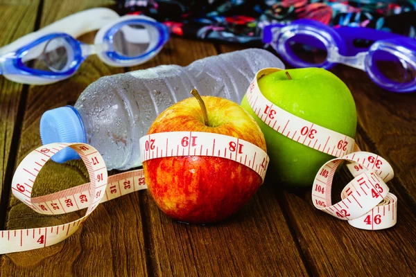 Healthy eating, fitness and weight loss concept, tape measure, a