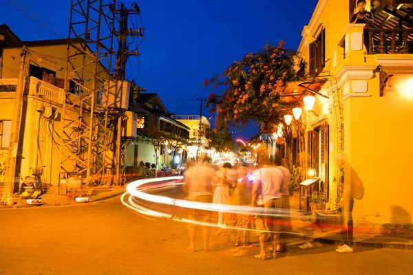 People on the street of Hoi An ancient town with long exposure effect, UNESCO World Heritage Site — Stock Photo, Image