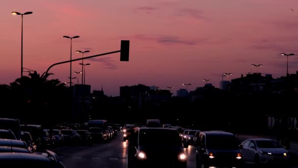 Car Headlights, Evening Traffic and City Skyline — стокове відео