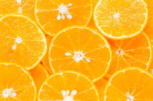 Skivad Färsk Apelsin Frukt Bit Bakgrund — Stockfoto