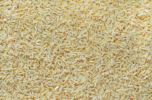清洁食品成分或农产品概念干有机糙米背景概览 — 图库照片