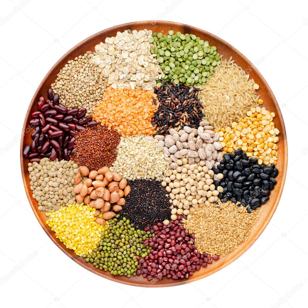 Variety kinds of natural cereal and grain seed pile in circle wooden tray isolated on white background