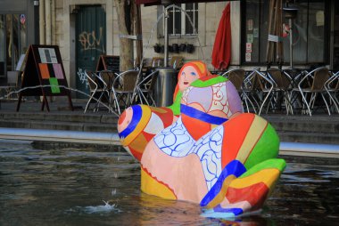PARIS, FRANCE -17 DECEMBER 2011: The Stravinsky Fountain near the Centre Georges Pompidou by sculptors Jean Tinguely and Niki de Saint Phalle clipart