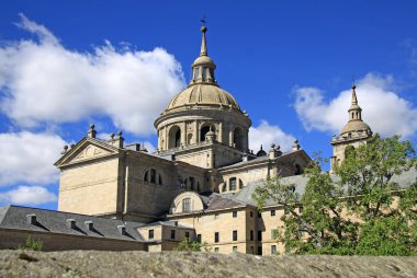 SAN LORENZO DE EL ESCORIAL, SPAIN - AUGUST 25, 2012: The Royal Site of San Lorenzo de El Escorial, a historical residence of the King of Spain, in the town of San Lorenzo de El Escorial