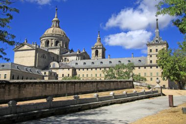 SAN LORENZO DE EL ESCORIAL, SPAIN - AUGUST 25, 2012: The Royal Site of San Lorenzo de El Escorial, a historical residence of the King of Spain, in the town of San Lorenzo de El Escorial