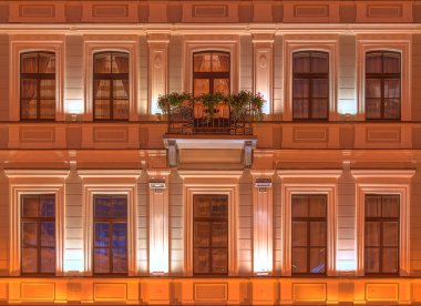 Windows on night facade of Kempinski Hotel Moika 22 clipart
